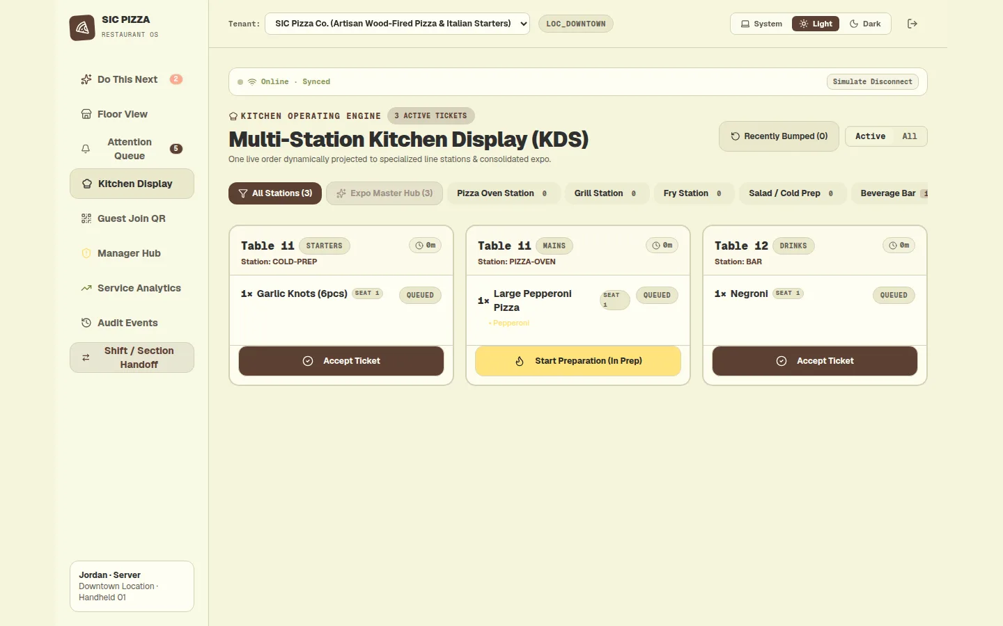 Desktop kitchen display with three station tickets, one pizza ticket accepted and showing a start preparation button